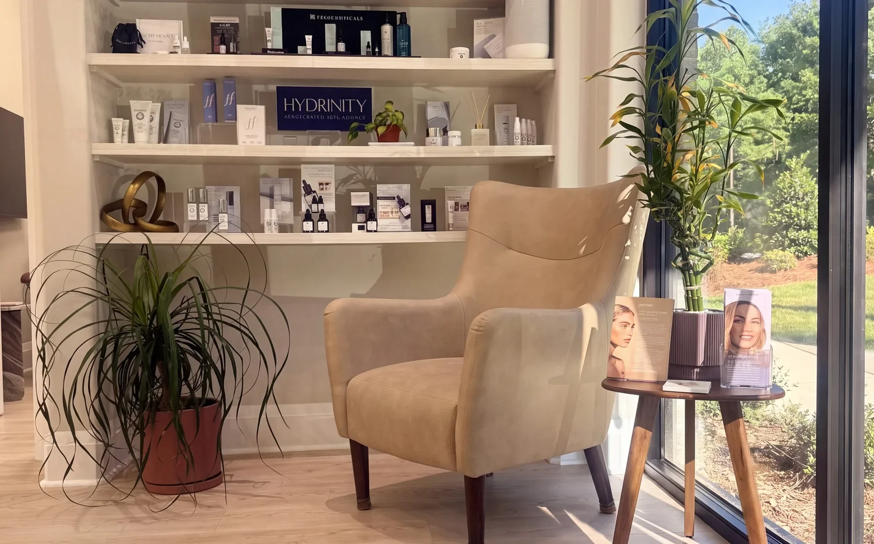 A beige armchair by the big window in the GENEVA Med lounge